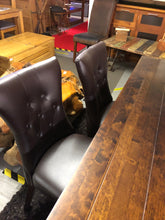 Load image into Gallery viewer, Dark wood table with 8 leather back button chairs
