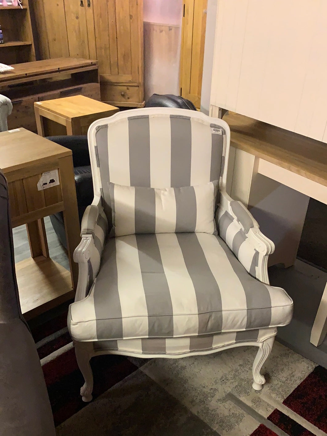 Grey and white striped armchair